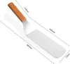 A spatula with a wooden handle is shown with dimensions indicated by lines and numbers. Anteprima dell’immagine prodotto