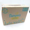 A cardboard box of Pampers diapers. Podgląd zdjęcia produktu