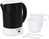 A kettle and two cups with spoons. Produktbild-Vorschau