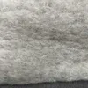 A close-up view of a gray woolen blanket. Produktbild-Vorschau