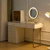 A vanity table with a mirror and drawers. Voir les images du produit
