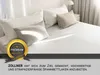 A neatly made bed with several pillows, bathed in soft light. Produktbild-Vorschau