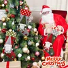 Santa Claus sitting next to a decorated Christmas tree, holding Christmas stockings and gifts. Náhľad obrázku produktu