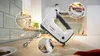A Bosch hand mixer is shown on a kitchen counter with close-up insets highlighting its features and use. Produktbild-Vorschau