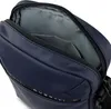 Close-up view of the inside of a dark blue shoulder bag. Náhled obrázku produktu