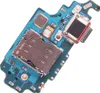 A close-up view of a smartphone's charging port and SIM card tray assembly on a blue circuit board, isolated on a white background. Produktbild-Vorschau