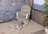 A light gray fabric recliner chair and ottoman set with a white frame, placed on a beige rug in front of a stone wall and a wooden wall with a picture frame. Anteprima dell’immagine prodotto
