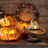 Halloween-themed decorations including carved pumpkins and a witch hat lamp. Produktbild-Vorschau