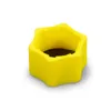 A yellow plastic cap with a star-shaped exterior and threaded interior. Produktbild-Vorschau
