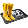 A black shoe tray with yellow boots and two pairs of sneakers on a white background. Náhled obrázku produktu