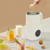 A soy milk maker is shown with ingredients and finished drinks, suggesting its use for making beverages. Podgląd zdjęcia produktu