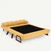 A yellow sofa bed is shown from a diagonal angle against a white background. Náhled obrázku produktu