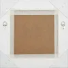 The back of a framed mirror is shown, with the backing board and hanging hardware visible. Produktbild-Vorschau