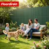 A family with a dog enjoying a backyard setting with a fence. Anteprima dell’immagine prodotto