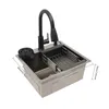 A kitchen sink with a faucet and dish rack, shown from a diagonal angle on a white background. Náhled obrázku produktu