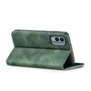 A green flip case for a smartphone, shown from the side with the cover open. Produktbild-Vorschau