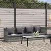 An outdoor sofa set with a coffee table on a paved patio, with a wooden fence and string lights in the background. Podgląd zdjęcia produktu