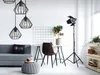 A modern living room or office space with a sofa, desk, chair, and decorative items. Produktbild-Vorschau