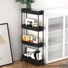 A black four-tier rolling storage cart filled with various items, placed next to a white cabinet. Produktbild-Vorschau
