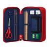 An open red pencil case with various stationery items inside. Anteprima dell’immagine prodotto