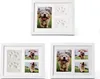 Three white photo frames displaying pictures of puppies and paw prints. Produktbild-Vorschau