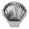 A single, silver-colored, shell-shaped baking mold is shown against a white background. Produktbild-Vorschau