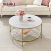 A round coffee table with a marble-like top and gold legs, placed in a living room setting with a sofa and rug. Produktbild-Vorschau
