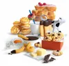 A collection of baked goods and dairy products, including cookies, toast with berries, milk, and chocolate. Náhľad obrázku produktu