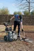 A person is using a pressure washer outdoors. Náhled obrázku produktu
