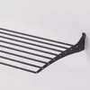 A black wall-mounted drying rack is shown against a white background. Voir les images du produit