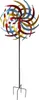 A metal wind spinner with colorful blades on a black pole with a four-pronged base. Produktbild-Vorschau