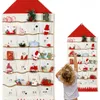 A child is reaching for an advent calendar hanging on a wall. Produktbild-Vorschau