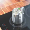 A milk frothing pitcher with a thermometer is placed on an induction cooktop. Anteprima dell’immagine prodotto
