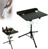 A tattoo workstation setup with a model in the background. Náhled obrázku produktu