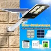 A solar street lamp mounted on a stone wall, with promotional graphics and text on a blue sky background. Anteprima dell’immagine prodotto