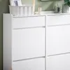 A close-up view of a white shoe cabinet with multiple drawers. Náhľad obrázku produktu