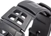 A close-up view of a black watch strap with a textured finish and a buckle mechanism. Produktbild-Vorschau