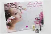 An advent calendar with a woman's face and flowers, with beauty products in front. Produktbild-Vorschau