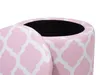 A close-up view of a pink and white patterned storage ottoman with its lid partially open, revealing the black interior. Produktbild-Vorschau