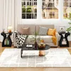 A living room scene with a sofa, coffee table, and side tables. Produktbild-Vorschau