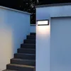 An outdoor staircase illuminated by a modern wall light. Náhled obrázku produktu