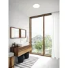 A modern bathroom with a large window overlooking a natural landscape. Produktbild-Vorschau