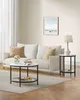A living room setting with a sofa, coffee table, and side table. Náhled obrázku produktu