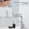 A woman washing her face with water from a faucet, with bathroom accessories in the foreground. Produktbild-Vorschau