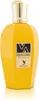 A yellow perfume bottle with a gold cap and a label. Voir les images du produit