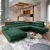 A spacious living room with a large green sectional sofa as the focal point, complemented by a modern kitchen in the background and dining area visible through an opening. Produktbild-Vorschau