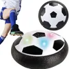 A child's legs and feet are shown kicking a hover soccer ball, with two hover soccer balls shown in the image. Podgląd zdjęcia produktu