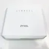 A white Zyxel router is shown from a front-facing, slightly elevated angle against a white background. Podgląd zdjęcia produktu