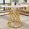A round dining table with a marble-effect top and a gold spiral base, set in a dining room with a window and a cabinet in the background. Voir les images du produit