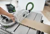 A person is using a Festool circular saw to cut a wooden plank. Anteprima dell’immagine prodotto